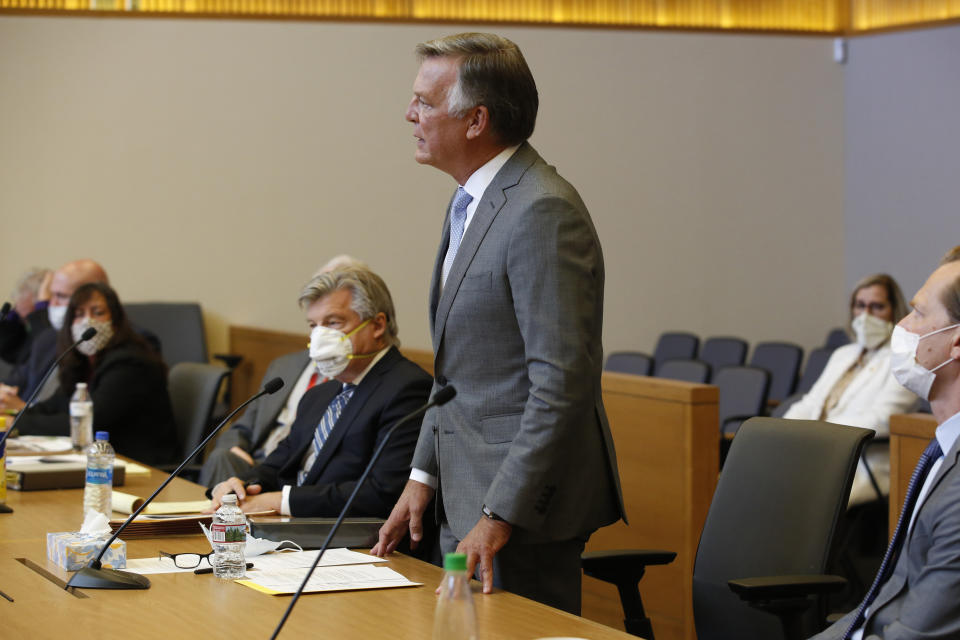 Bill Smith, interim chief executive officer and president of PG&E Corp., makes a closing statement during the criminal sentencing hearing in the trial of Pacific Gas & Electric Corp in Chico, Calif., Thursday, June 18, 2020. Pacific Gas & Electric on Thursday was fined $4 million for the deaths of 84 people killed in a nightmarish Northern California wildfire ignited by the its long-neglected electrical grid. The sentencing comes as the nation's largest utility prepares to end a 17-month bankruptcy proceeding triggered by the catastrophe. (AP Photo/Rich Pedroncelli, Pool)