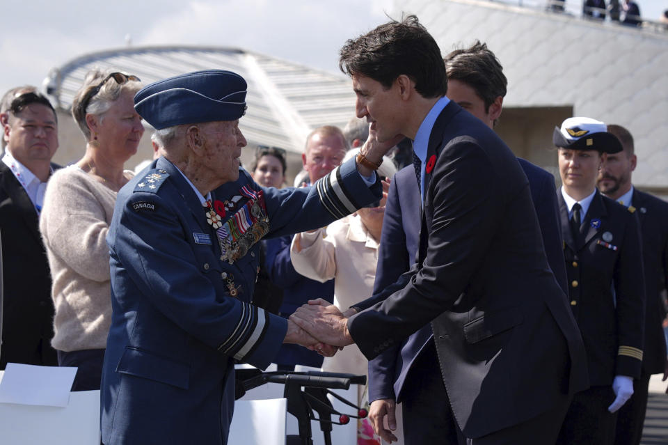 Canadian Prime Minister Justin Trudeau meets Richard Rohmer, 100, one of the most decorated Canadian veterans, at the Government of Canada ceremony to mark the 80th anniversary of D-Day, at Juno Beach, in Courseulles-sur-Mer, Normandy, France, Thursday, June 6, 2024. (Jordan Pettitt, Pool Photo via AP)