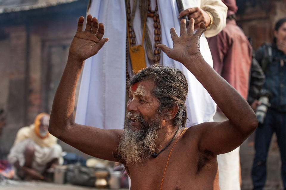 KATHMANDU, NEPAL - FEBRUARY 17:  A Shadu, or holy man, greets other holy men inside Pashupatinath temple during the celebration of the Maha Shivaratri festival on February 17, 2015 in Kathmandu, Nepal. 