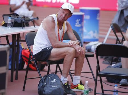 File Photo: Alberto Salazar, coach to Mo Farah of Great Britain and Galen Rupp of the U.S.A. sits inside the Bird's Nest Stadium at the Wold Athletics Championships in Beijing, China, August 21, 2015. REUTERS/Phil Noble