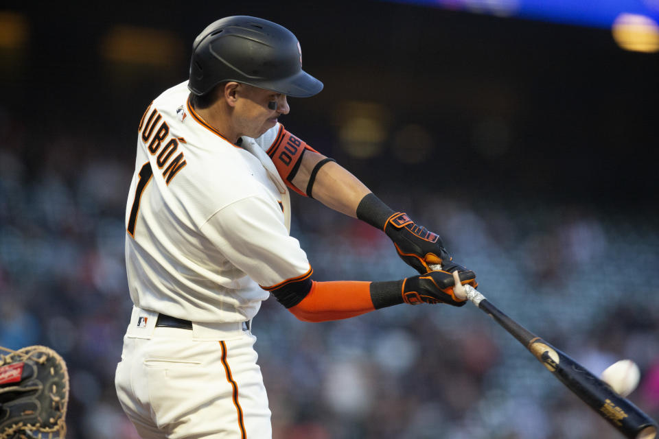 San Francisco Giants' Mauricio Dubón (1) connects for a two-run home run off Colorado Rockies starting pitcher Austin Gomber during the third inning of a baseball game, Monday, May 9, 2022, in San Francisco. Giants' Austin Slater also scored on the hit. (AP Photo/D. Ross Cameron)