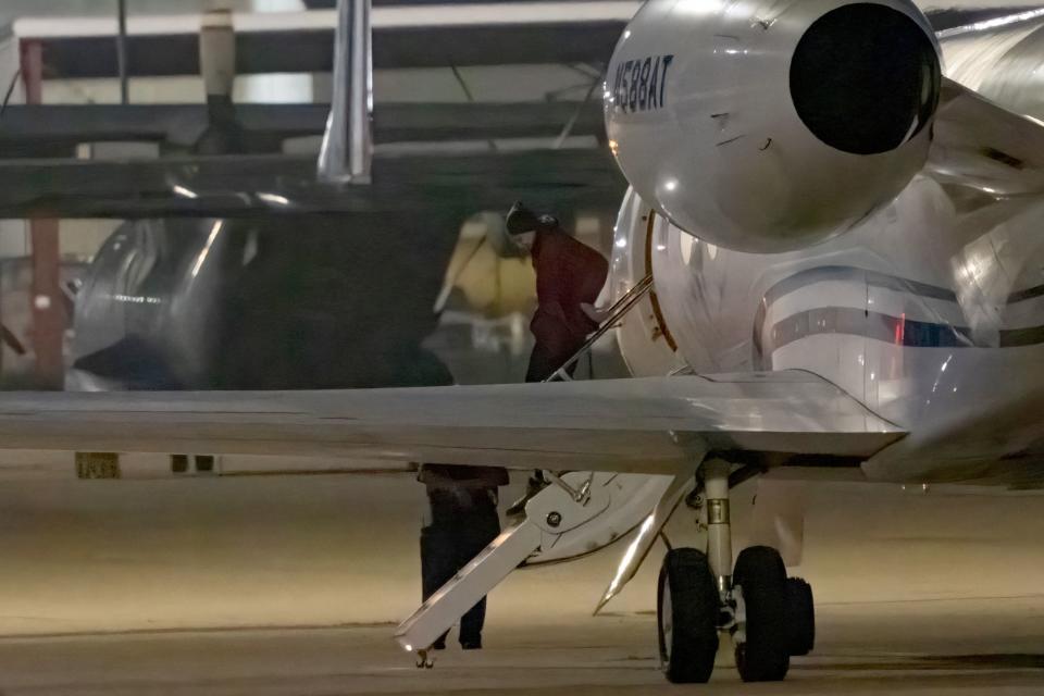 TOPSHOT - American basketball star Brittney Griner gets out of a plane after landing at the JBSA-Kelly Field Annex runway on December 9, 2022 in San Antonio, after she was released from a Russian prison in exchange for a notorious arms dealer. - WNBA player Griner, 32, who was arrested in Russia in February on drug charges, was expected to be transferred to a nearby military facility for medical checks, US media reported. (Photo by SUZANNE CORDEIRO / AFP) (Photo by SUZANNE CORDEIRO/AFP via Getty Images)