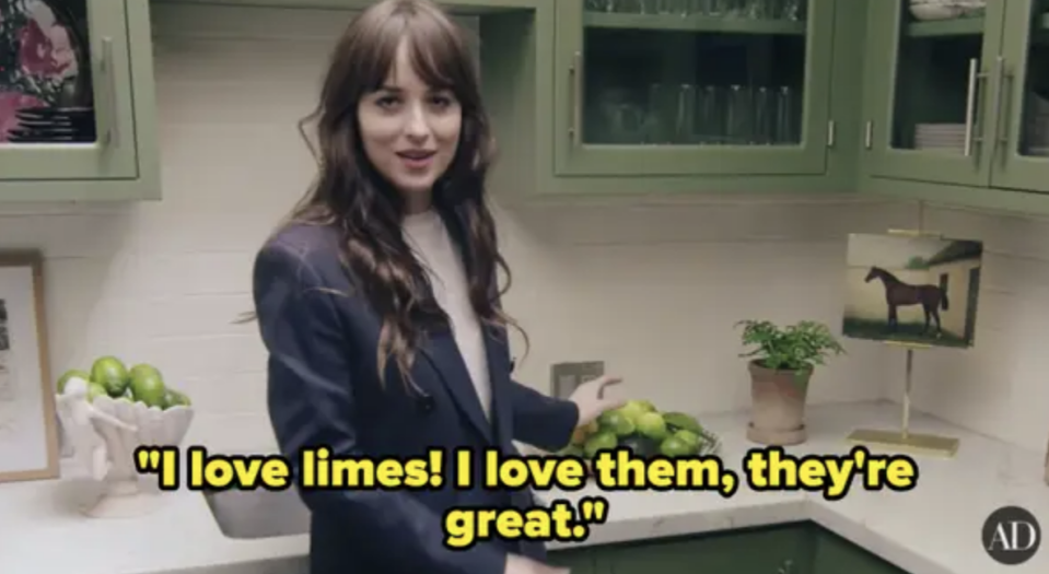 Dakota in a blazer standing in a kitchen with text "I love limes! I love them, they're great."