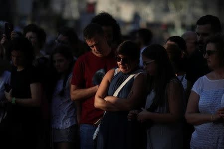 People gather at an impromptu memorial where a van crashed into pedestrians at Las Ramblas in Barcelona, Spain, August 20, 2017. REUTERS/Susana Vera