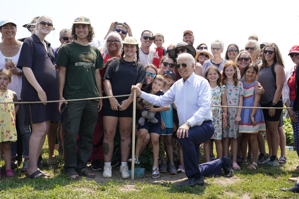 President Joe Biden poses for a photo after touring King Orchards fruit farm Saturday, July 3, 2021, in Central Lake, Mich. (AP Photo/Alex Brandon)