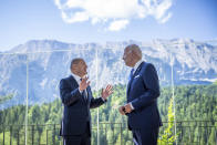 German Chancellor Olaf Scholz, left, welcomes US President Joe Biden, right, for a bilateral meeting at Castle Elmau in Kruen, near Garmisch-Partenkirchen, Germany, on Sunday, June 26, 2022. The Group of Seven leading economic powers are meeting in Germany for their annual gathering Sunday through Tuesday. (Michael Kappeler/dpa via AP)