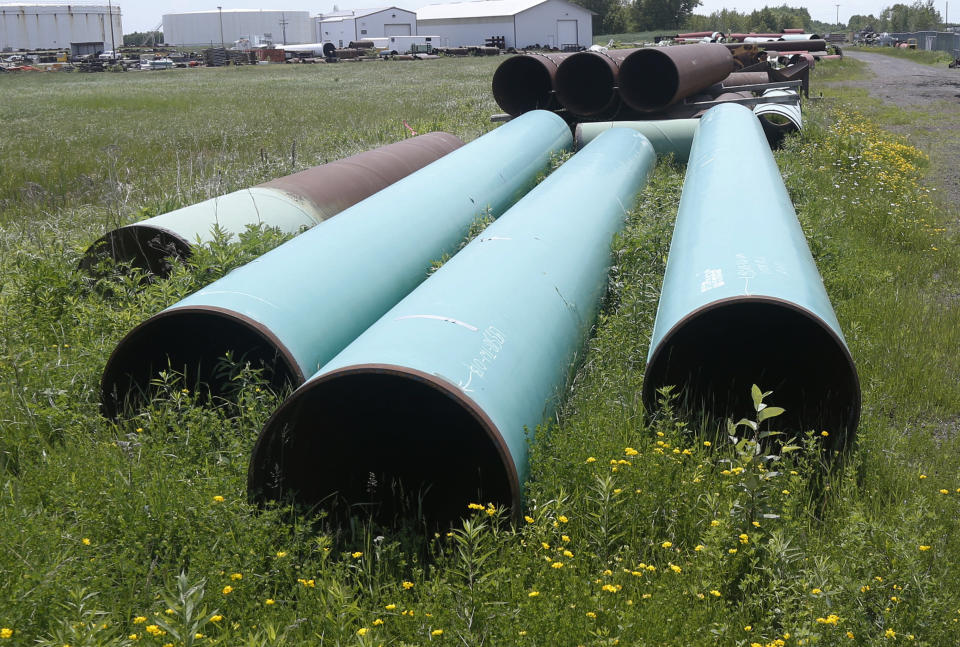 FILE - In this June 29, 2018 file photo, pipeline used to carry crude oil is shown at the Superior terminal of Enbridge Energy in Superior, Wis. An updated environmental review released by a state agency Monday, Dec. 9, 2019, found no serious threat to Lake Superior if crude oil ever leaked from a new pipeline to replace Enbridge Energy's aging Line 3 across northern Minnesota. (AP Photo/Jim Mone, File)