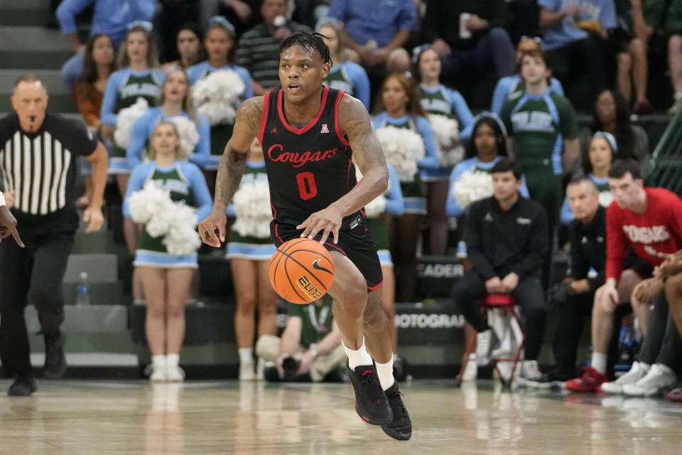 Houston guard Marcus Sasser (0) moves the ball down court during the first half of an NCAA college basketball game against Tulane in New Orleans, Tuesday, Jan. 17, 2023. Houston won 80-60. (AP Photo/Gerald Herbert)