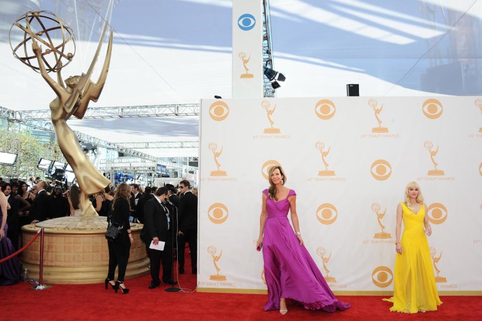 Allison Janney and Anna Faris, right, arrive at the 65th Primetime Emmy Awards at Nokia Theatre on Sunday Sept. 22, 2013, in Los Angeles. (Photo by Jordan Strauss/Invision/AP)