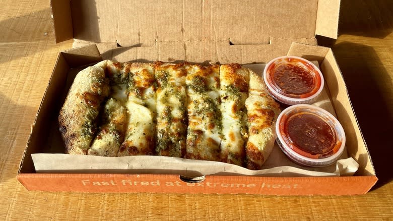 cheesy bread with pesto and red sauce