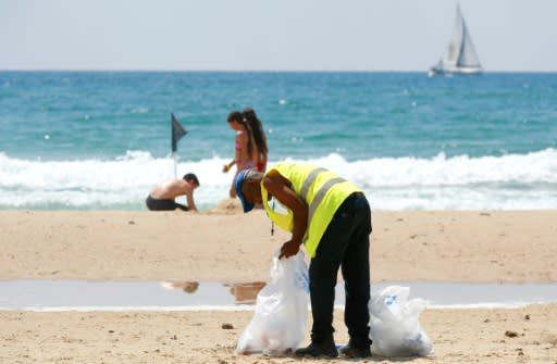Volunteers join beach cleanups in Israel, whose Tel Aviv coastline was found to be the third most polluted by plastic waste in the Mediterranean in a WWF report in June