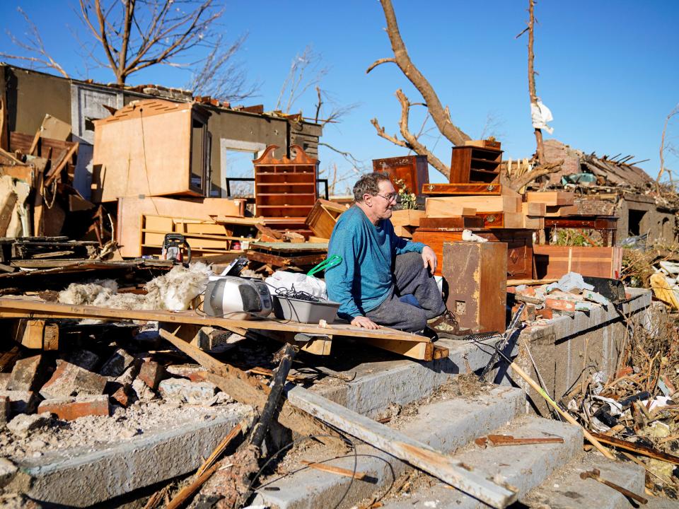 Rick Foley, 70, sits outside his home after a devastating outbreak of tornadoes ripped through several U.S. states in Mayfield, Kentucky, U.S. December 11, 2021 (REUTERS)