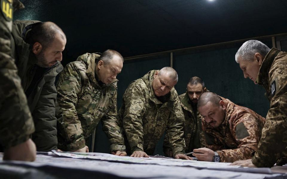 Commander-in-Chief of the Armed Forces of Ukraine Oleksandr Syrsky (2nd L) and Ukraine's Defence Minister Rustem Umerov (L) visiting frontline positions