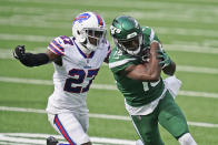Buffalo Bills' Tre'Davious White, left, chases New York Jets' Chris Hogan during the first half of an NFL football game, Sunday, Oct. 25, 2020, in East Rutherford, N.J. (AP Photo/John Minchillo)
