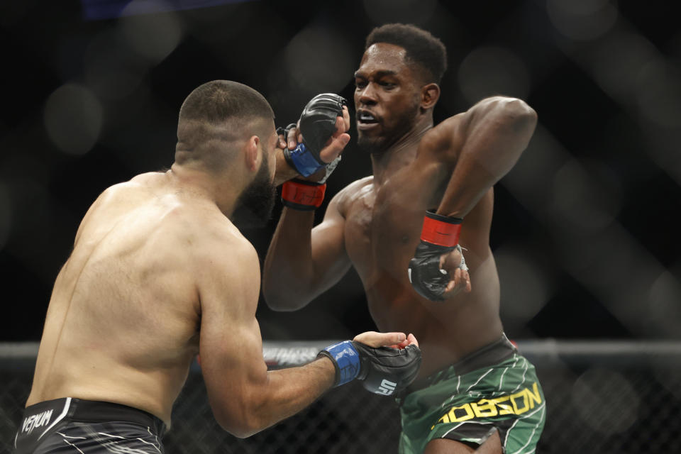 Feb 12, 2022; Houston, Texas, UNITED STATES; AJ Dobson (red gloves) fights Jacob Malkoun (blue gloves) during UFC 271 at Toyota Center. Mandatory Credit: Troy Taormina-USA TODAY Sports