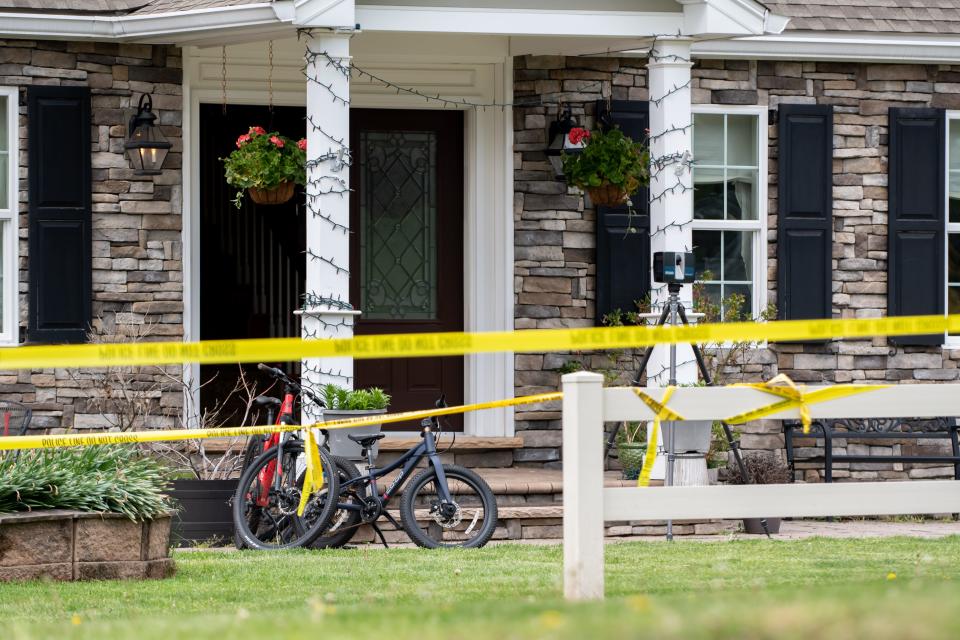 Two bicycles sit parked outside an Upper Makefield home where two boys, 10 and 13 years old, were shot Monday morning. By noon, their mother, 38-year-old Trinh Nguyen, was taken into police custody for the shooting, according to Bucks County District Attorney Matthew Weintraub.