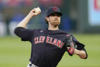 Cleveland Indians starting pitcher Shane Bieber throws during the first inning of a baseball game against the Kansas City Royals Wednesday, May 5, 2021, in Kansas City, Mo. (AP Photo/Charlie Riedel)