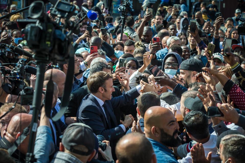 Macron greets the crowd in Saint Denis (EPA)