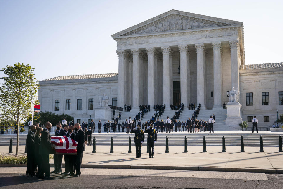 Pallbearers carry the casket of Ruth Bader Ginsburg outside the Supreme Court in Washington, D.C.