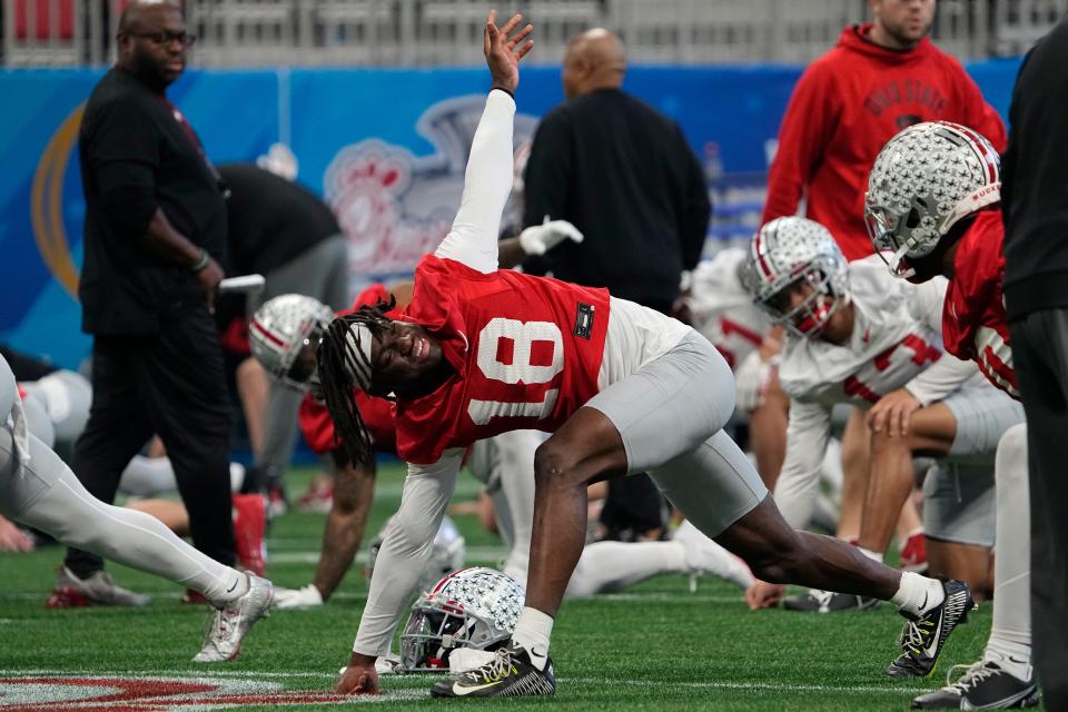 Dec 29, 2022; Atlanta, GA, USA;  Ohio State Buckeyes wide receiver Marvin Harrison Jr. (18) warms up during a team practice for the Peach Bowl game against the Georgia Bulldogs in the College Football Playoff semifinal at Mercedes Benz Stadium. Mandatory Credit: Adam Cairns-The Columbus Dispatch