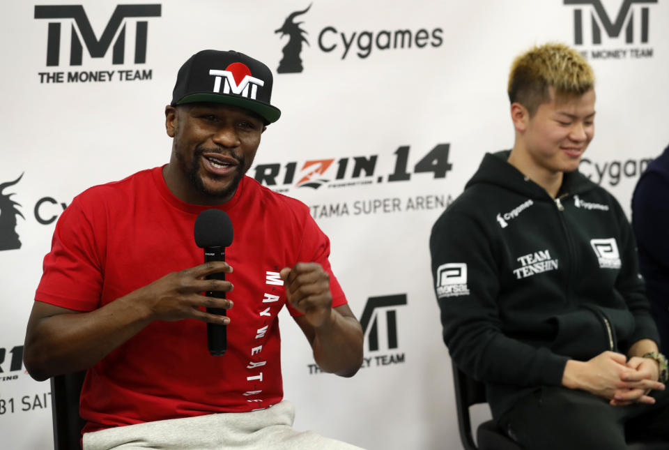 Floyd Mayweather Jr., left, speaks as Japanese kickboxer Tenshin Nasukawa listens during a news conference in Las Vegas on Thursday, Dec. 6, 2018. Mayweather is scheduled to fight Nasukawa in a three-round exhibition boxing bout in Japan on New Year's Eve. (Steve Marcus/Las Vegas Sun via AP)