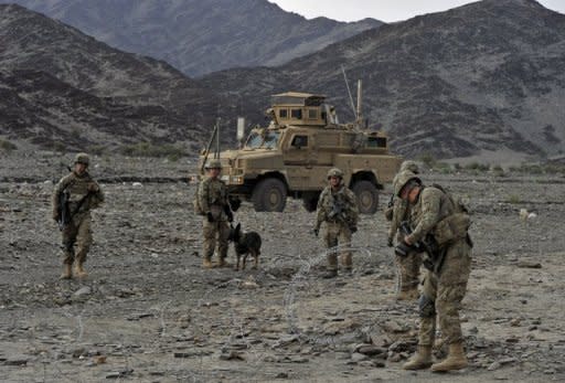 File photo shows US soldiers setting up concertina wire during a mission in the Turkham Nangarhar region of Afghanistan bordering Pakistan. Washington and Kabul have hailed breakthroughs towards signing a treaty on relations after 2014 -- but it will not cover the crucial issue of the status of any US troops remaining in Afghanistan