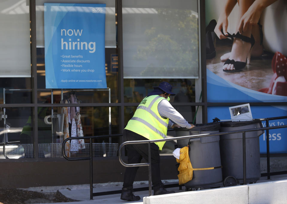 SAUSALITO, CALIFORNIA - JUNE 03: A worker pushes a cart by a Now Hiring sign outside of a Ross store on June 03, 2021 in Sausalito, California. According to a U.S. Labor Department report, jobless claims fell for a fifth straight week to 385,000. (Photo by Justin Sullivan/Getty Images)