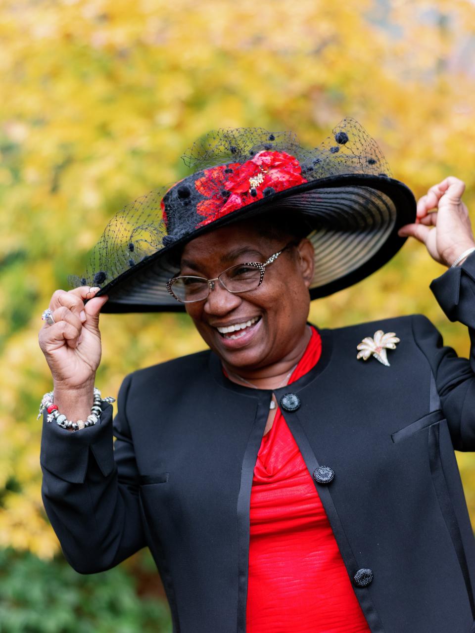 Willie Richardson models one of her trademark hats and smiles during a photo shoot with family friend Erich McVey on Nov. 6, 2019, in Salem, Ore.