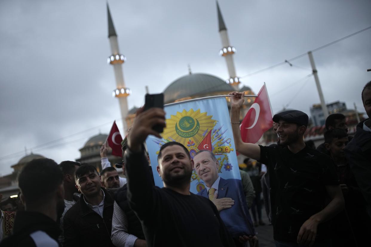 Supporters of the President Recep Tayyip Erdogan celebrate in Istanbul, Turkey, Sunday, May 28, 2023. Turkey's incumbent President Recep Tayyip Erdogan has declared victory in his country's runoff election, extending his rule into a third decade. (AP Photo/Emrah Gurel)