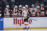 Philadelphia Flyers left wing Noah Cates (49) celebrates with teammates after scoring against the Minnesota Wild during the first period of an NHL hockey game Thursday, Jan. 26, 2023, in St. Paul, Minn. (AP Photo/Abbie Parr)