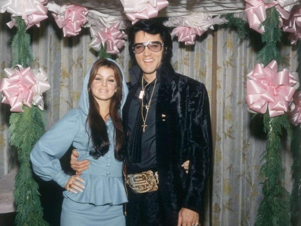 American rock legend Elvis Presley and his wife Priscilla attend George Klein's wedding with Barbara Little in Elvis' International Hotel Suite on December 05, 1970.