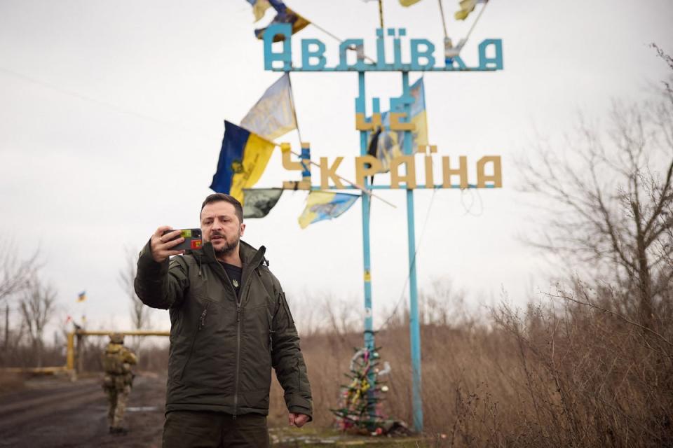Volodymyr Zelensky recording a video address in front of a sign reading ‘Avdiivka is Ukraine' (Ukrainian Presidential Presser)