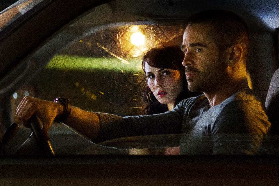 This film image released by FilmDistrict shows Noomi Rapace , left, and Colin Farrell in a scene from "Dead Man Down." (AP Photo/FilmDistrict, John Baer)
