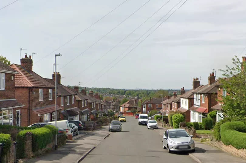 Google Maps street view screenshot of Willbert Road, Arnold, from centre of street looking down gradient with grey sky and houses left and right
