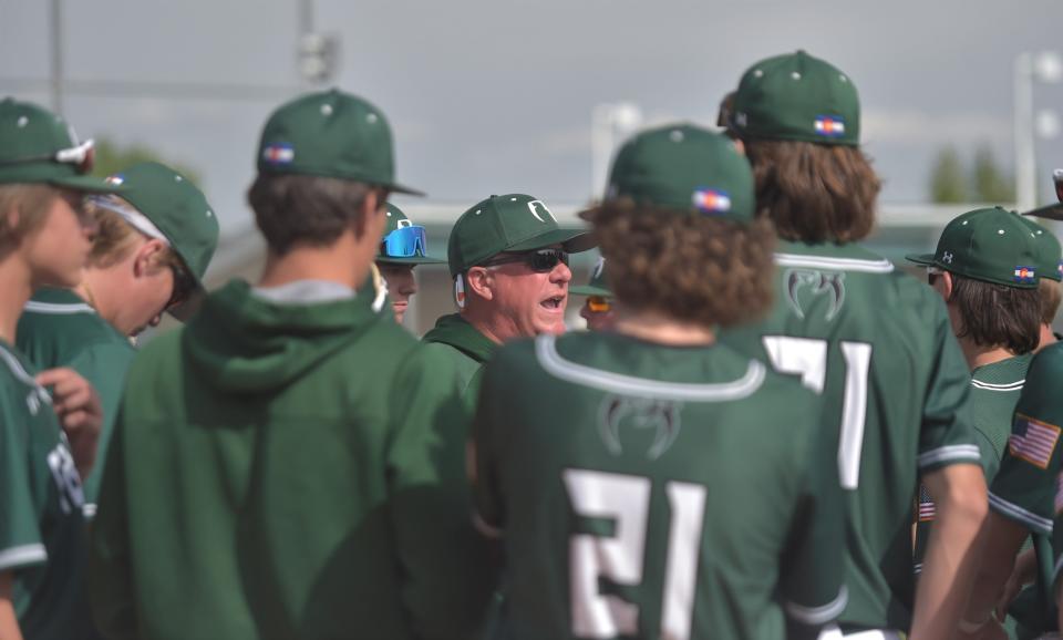 Fossil Ridge baseball coach Chris Moddelmog delivers a speech to his team between innings during a 5A regional final against Douglas County on Sunday, May 22, 2022, at Fossil Ridge High School.