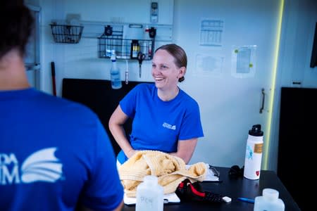 Chief coral scientist Keri O'Neill laughs in an aquarium facility full of Pillar coral (Dendrogyra cylindricus) just a few days before the animals would successfully spawn in an aquarium for the first time at a Florida Aquarium facility in Apollo Beach, Fl