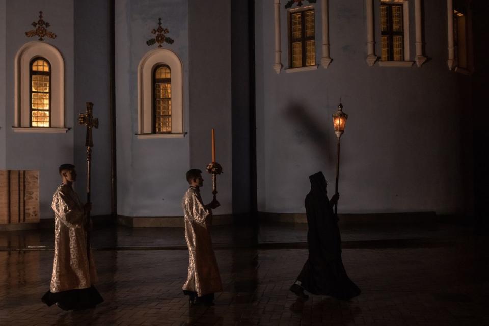 Priests attend the procession during the Orthodox Easter service by Metropolitan Epiphanius of the Orthodox Church of Ukraine at Saint Michael's Golden-Domed Monastery, late on April 15, 2023 in Kyiv, Ukraine. (Roman Pilipey/Getty Images)