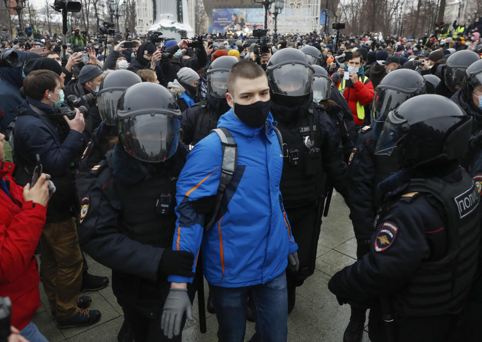 Police detain a man during a protest against the jailing of opposition leader Alexei Navalny in Moscow, Russia, Saturday, Jan. 23, 2021. Russian police are arresting protesters demanding the release of top Russian opposition leader Alexei Navalny at demonstrations in the country's east and larger unsanctioned rallies are expected later Saturday in Moscow and other major cities. (AP Photo/Pavel Golovkin)