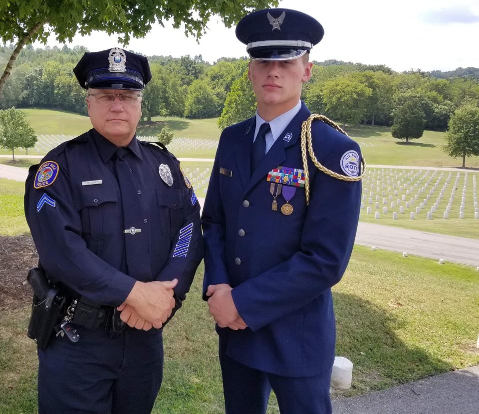 Ronnie Hill "RJ" in his High School JROTC uniform with his Dad, Ronnie Hill, at a funeral for a Veteran.(Credit: Caryn Hill)