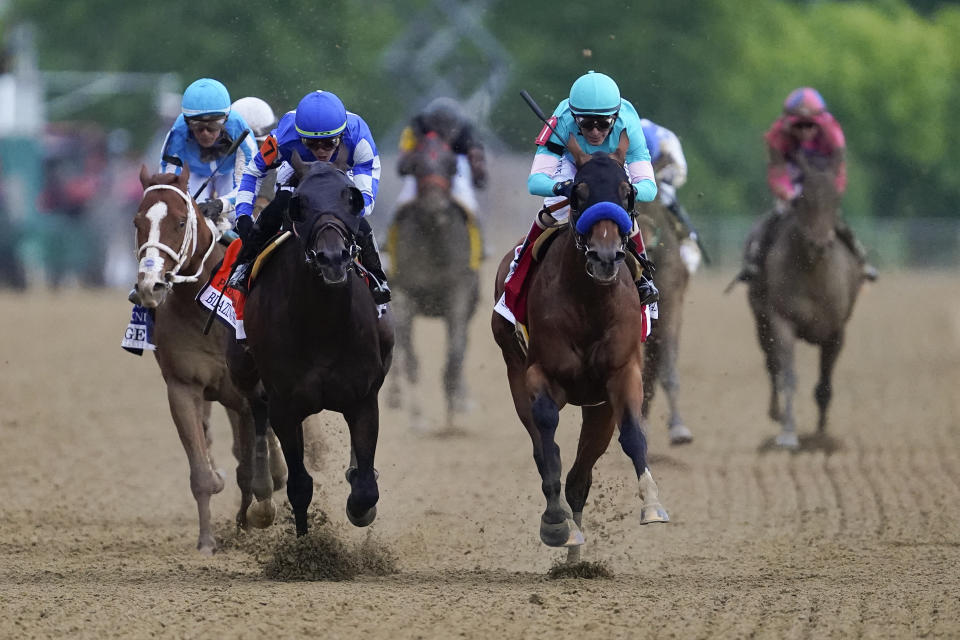 National Treasure, with jockey John Velazquez, front right, edges out Blazing Sevens, with jockey Irad Ortiz Jr., second from left, to win the148th running of the Preakness Stakes horse race at Pimlico Race Course, Saturday, May 20, 2023, in Baltimore. Kentucky Derby winner Mage, back left, finished third. (AP Photo/Nick Wass)