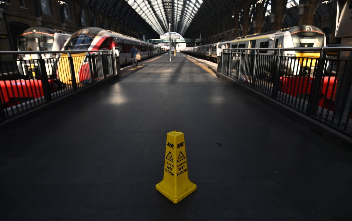 A near-deserted King’s Cross station in central London on Saturday  (EPA)