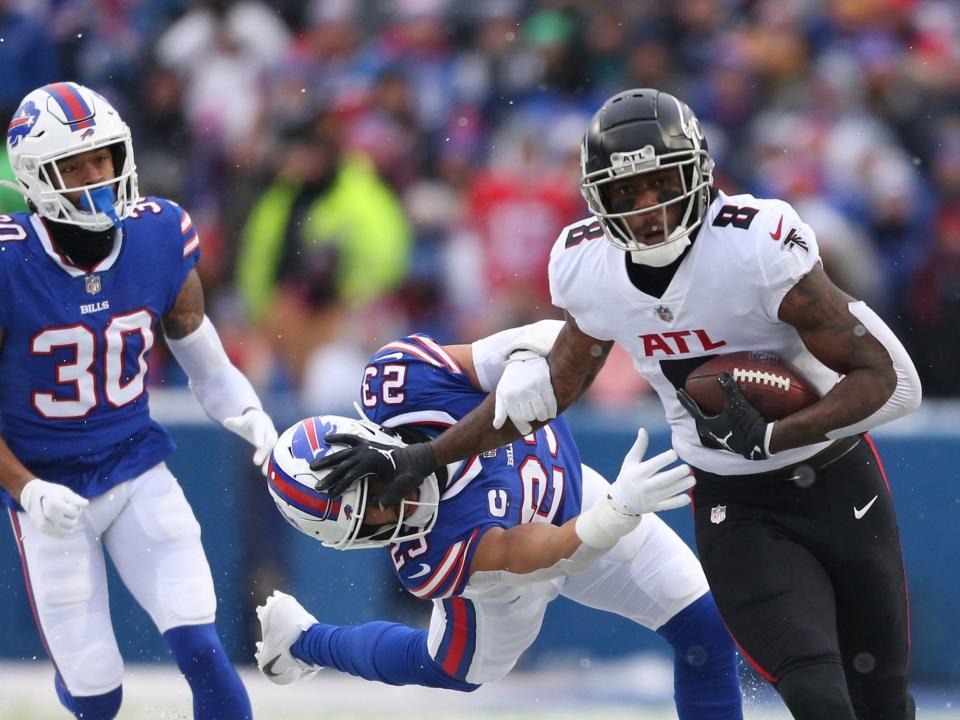 Kyle Pitts fights off a defender against the Buffalo Bills.