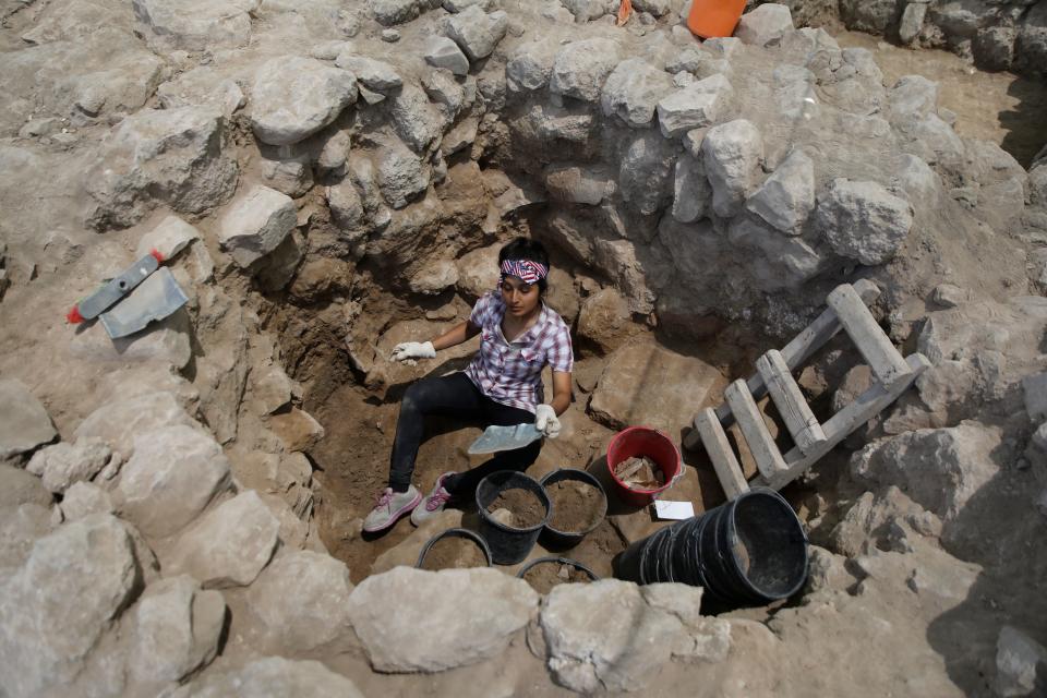 An Archaeologist takea part in excavations at a site claimed to be the Biblical town of Ziklag near the southern Israeli city of Kiryat Gat on July 8, 2019. - Researchers in Israel said they have pinpointed the site of an ancient Philistine town mentioned in the biblical tale of David seeking refuge from the Israelite king Saul. Ziklag was a town under the rule of a Philistine king in nearby Gath after the ancient "sea peoples" began arriving in the region in the 12th century BC, the researchers say. (Photo by MENAHEM KAHANA / AFP)        (Photo credit should read MENAHEM KAHANA/AFP/Getty Images)