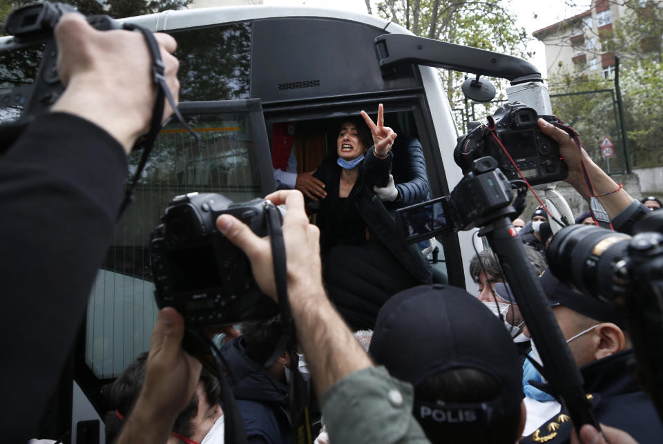 A demonstrator, wearing a face mask for protection against coronavirus, gestures and screams as she is pushed into a police van along with others, during May Day protests in Istanbul, Friday, May 1, 2020. Police in Istanbul detained several demonstrators who tried to march toward Istanbul’s symbolic Taksim Square in defiance of the lockdown imposed by the government due to the coronavirus outbreak. (AP Photo/Emrah Gurel)