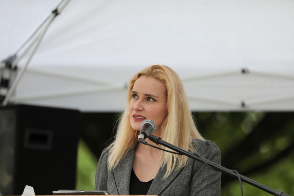 Salem City Councilor Vanessa Nordyke delivers remarks during a memorial for houseless and unsheltered individuals who have died in recent years, at Marion Square Park in Salem, Ore. on Thursday, May 26, 2022.