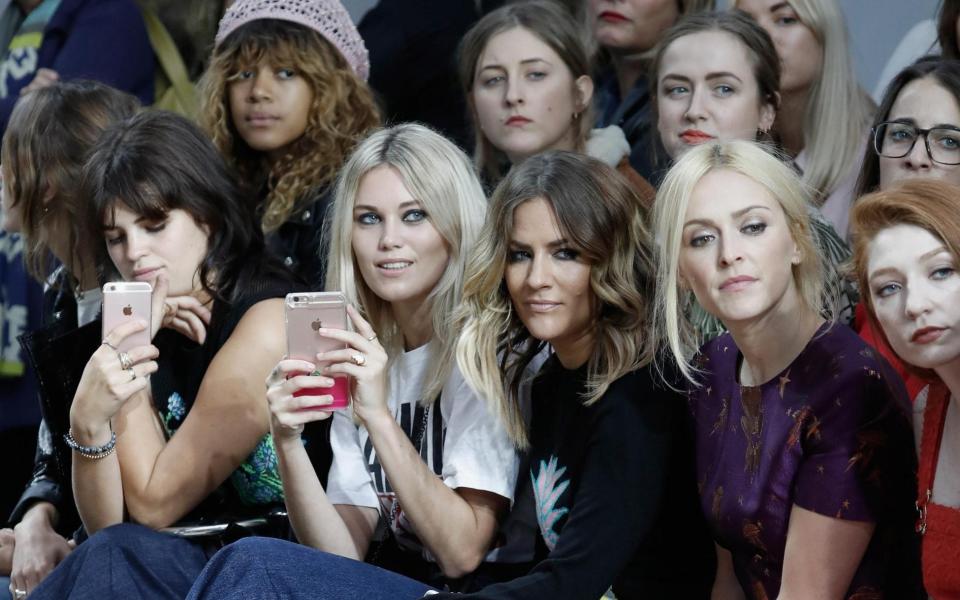  Front row next to the late Caroline Flack - Getty