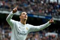 Ronaldo double keeps pressure on Barca