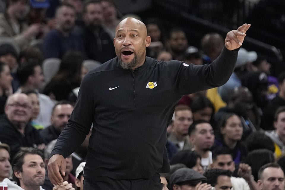 Los Angeles Lakers coach Darvin Ham signals to players during the first half of the team's NBA basketball game against the San Antonio Spurs in San Antonio, Friday, Dec. 15, 2023. (AP Photo/Eric Gay)