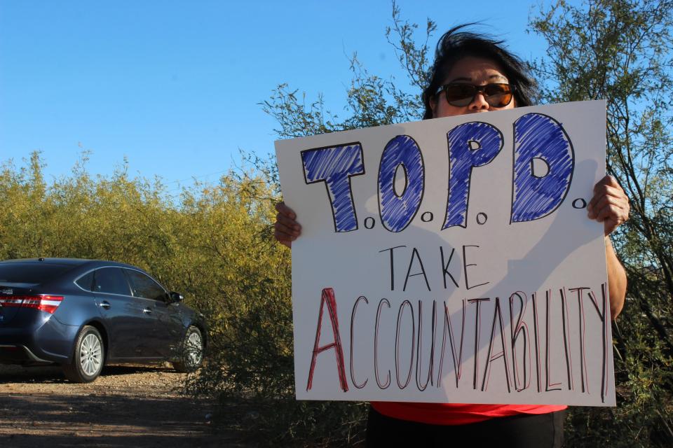 The family of Raymond Mattia and attendees gather outside of the Tohono O'odham Nation Police Department in Sells, Arizona, for a peaceful protest calling for more accountability from the department on Friday, December 15, 2023.