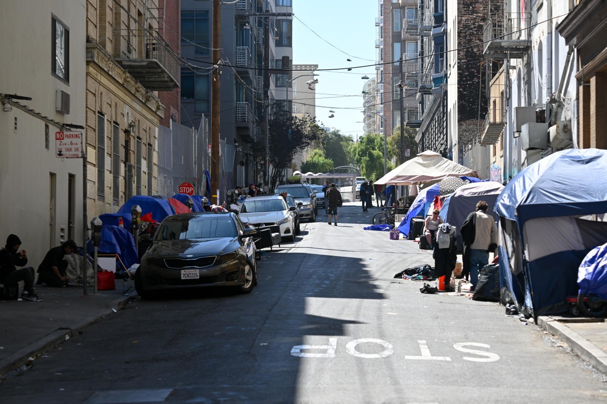 Tents and homeless people line a street in San Francisco’s Tenderloin neighborhood.
